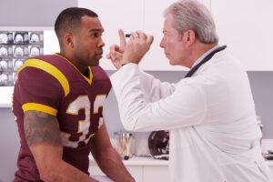 Football Player with Doctor